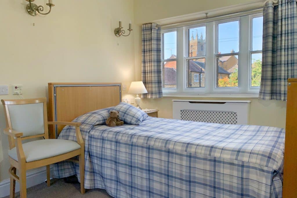 A bedroom with a view of the village church at Featherton House care home in Deddington near Banbury.