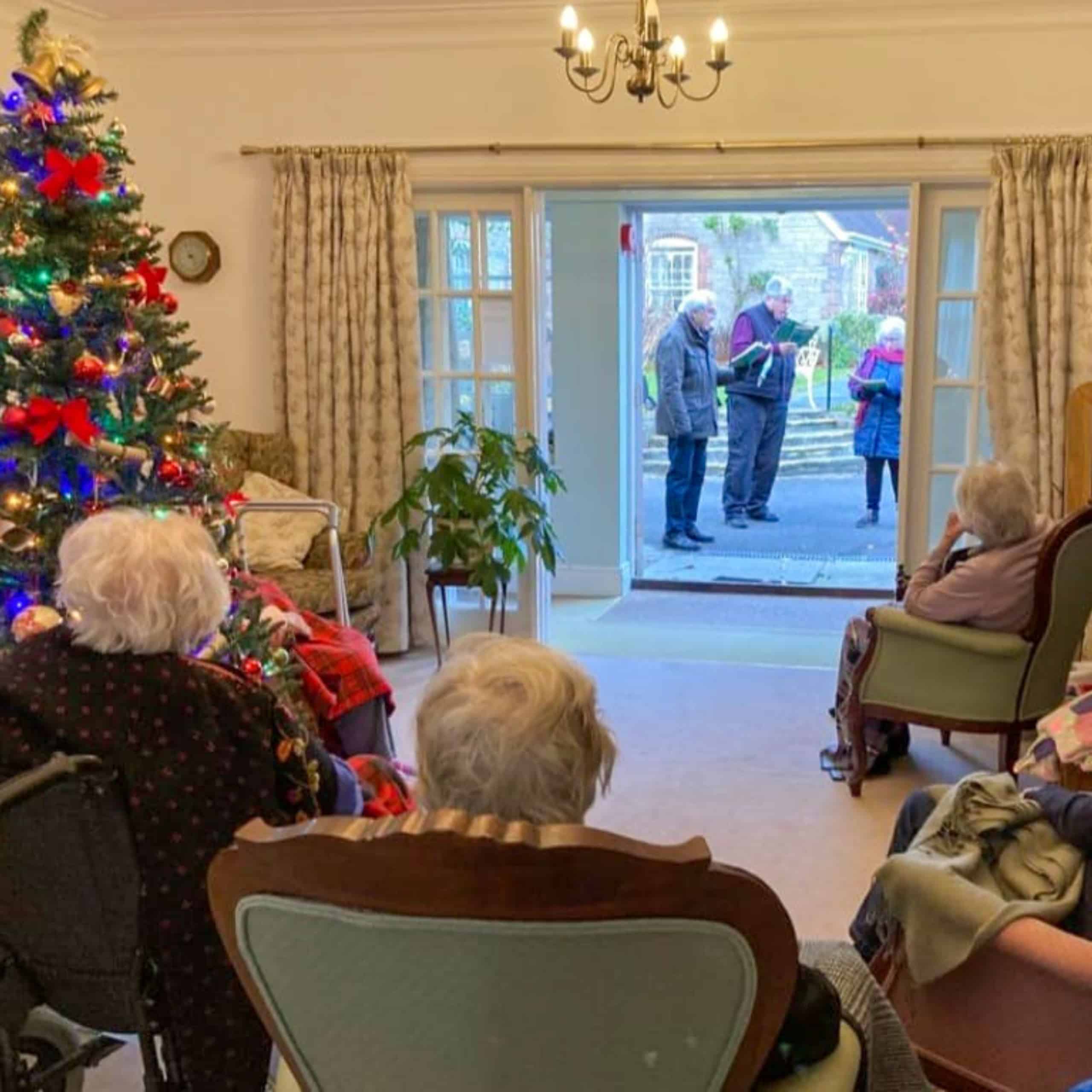 Residents of Wren House Care Home enjoying a festive performance from the Minster Church choir.