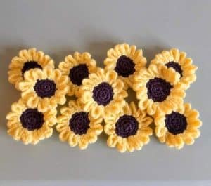 Handmade woolen sunflowers sold by Wren House to raise funds for the DEC Ukraine appeal.