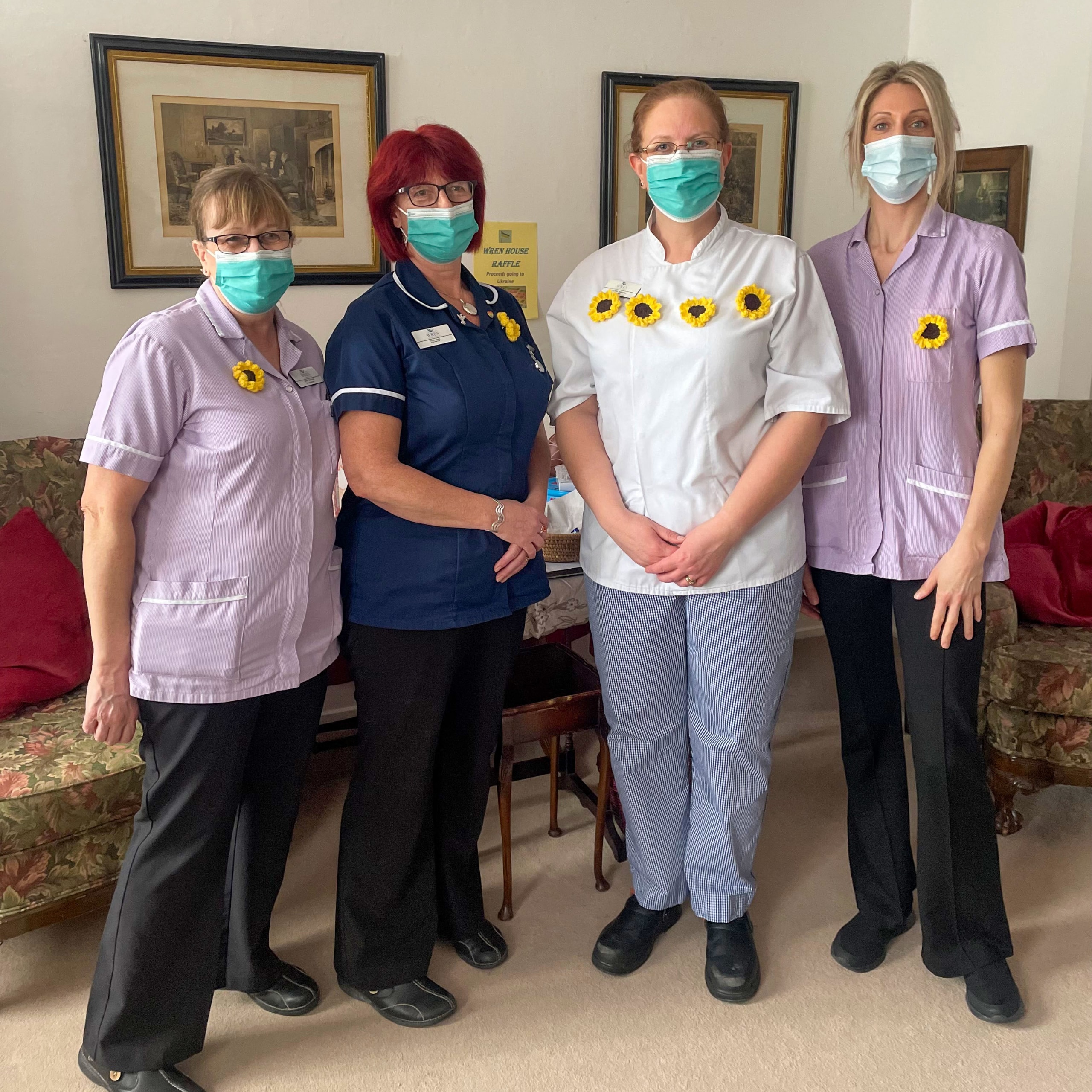 The team at Wren House Care Home in Warminster proudly wearing their handmade sunflowers in support of the DEC Ukraine Humanitarian Aid Appeal.