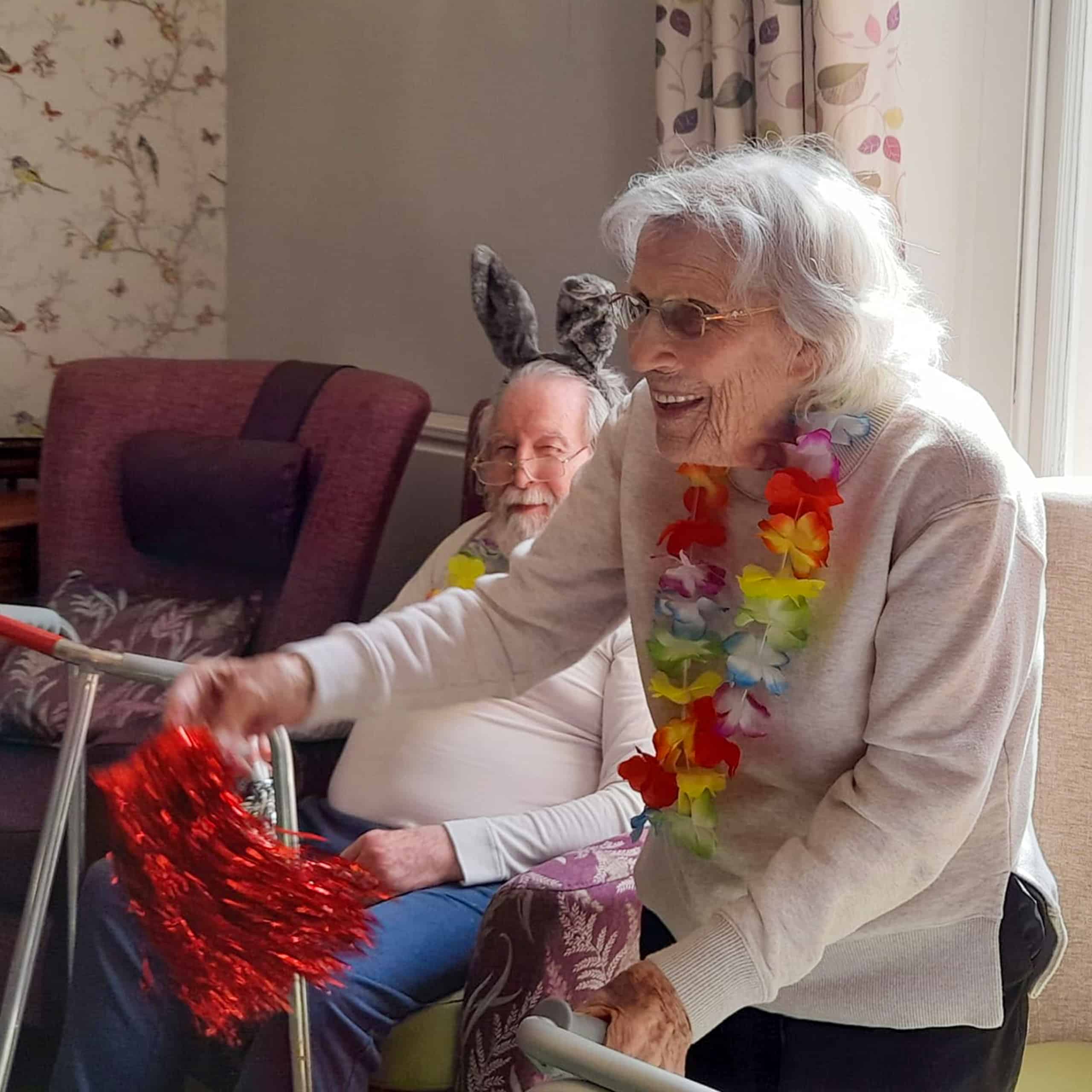 A Westerham Place Care Home Resident enjoys dancing to live entertainment in the home's lounge.